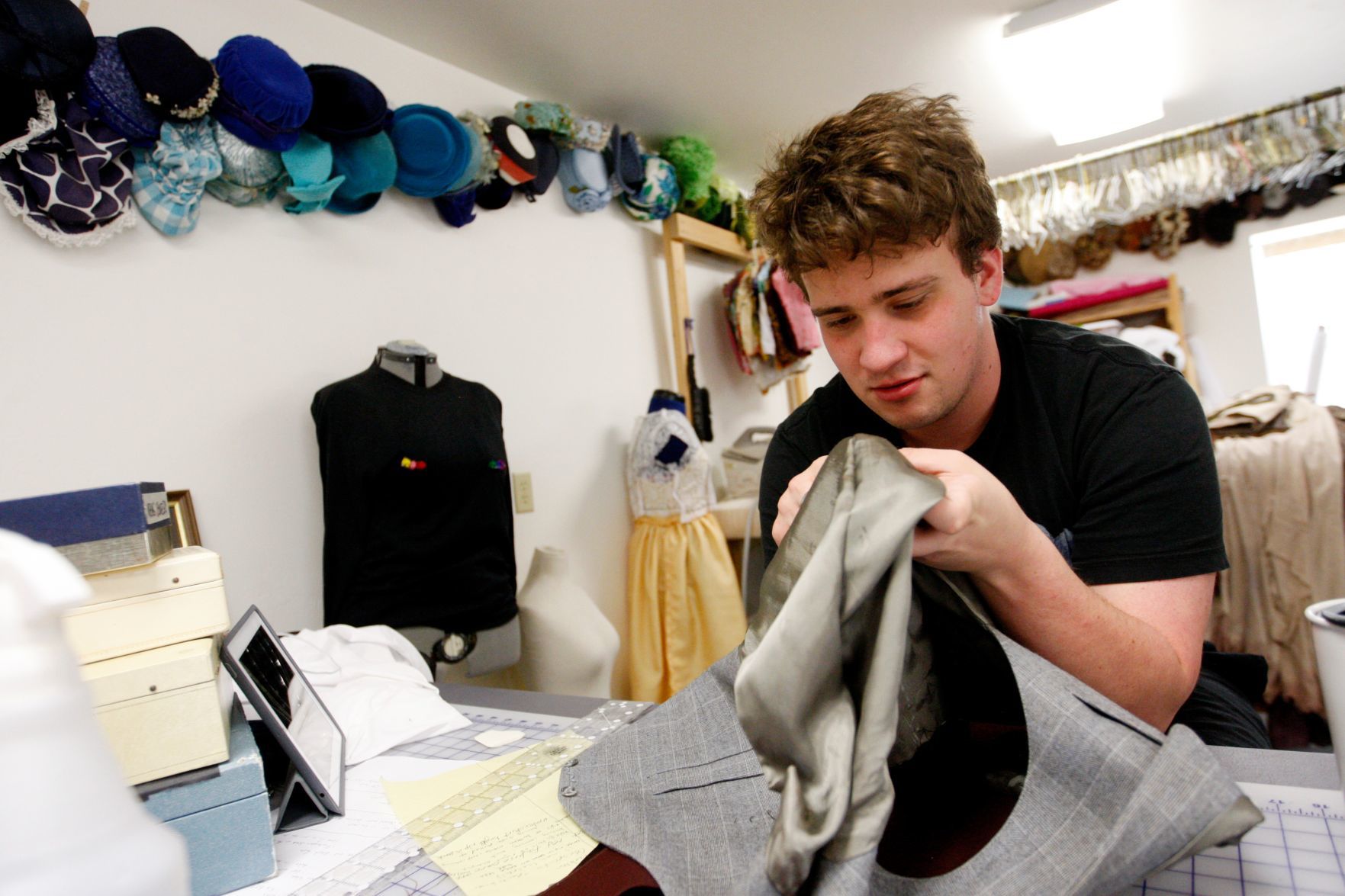 Ethan Henry repairs his costume